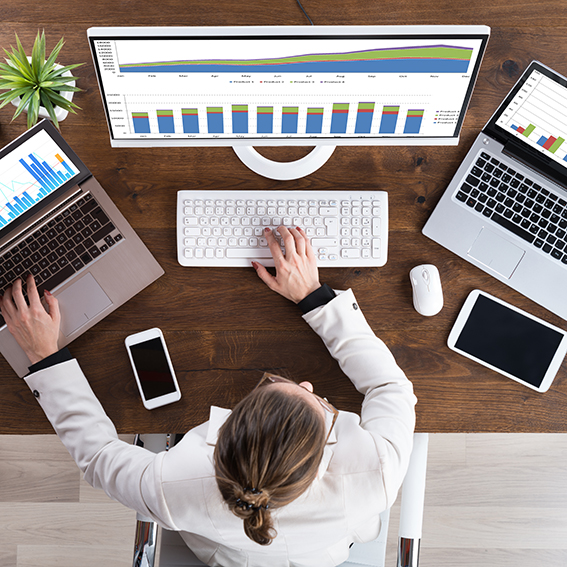 Businesswoman Working With Graphs On Computer