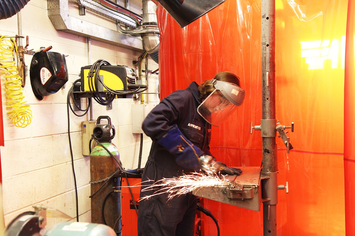 Cornwall College Pendennis apprentice welding metal in a workshop