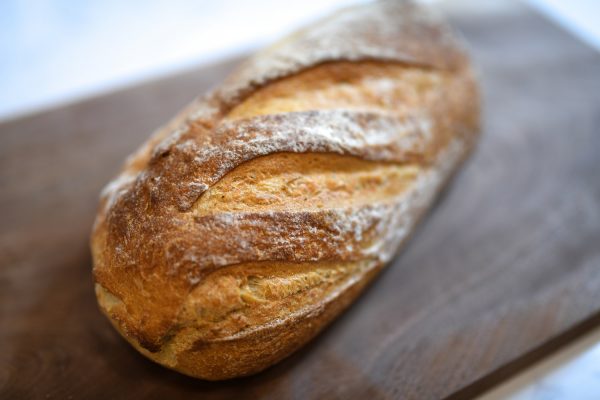 Freshly baked break on a wooden serving board