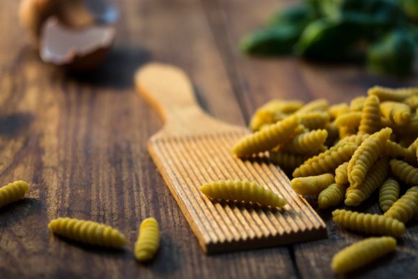 Freshly rolled pasta on a wooden board