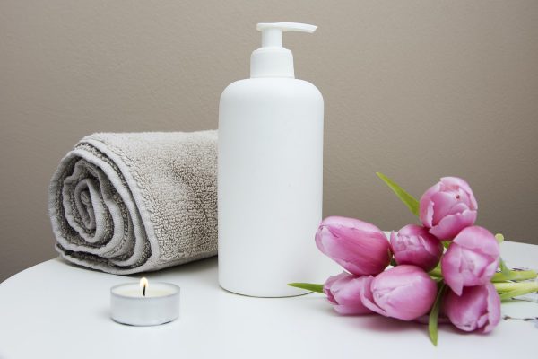 Spa setting with Candles, Tulips and Lotion