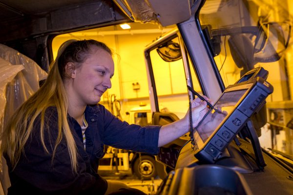 Student mechanic working on HGV