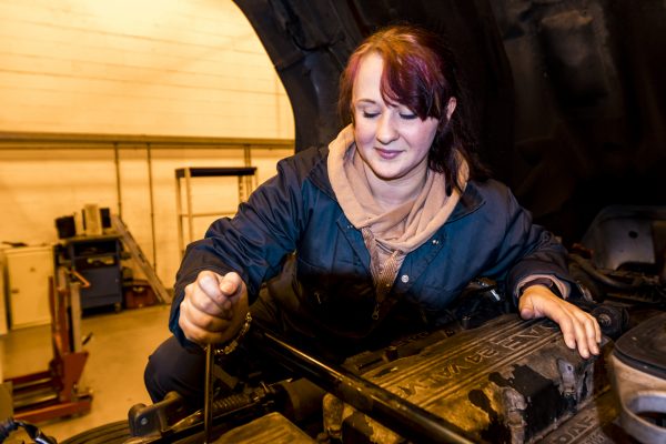 Student mechanic working on HGV