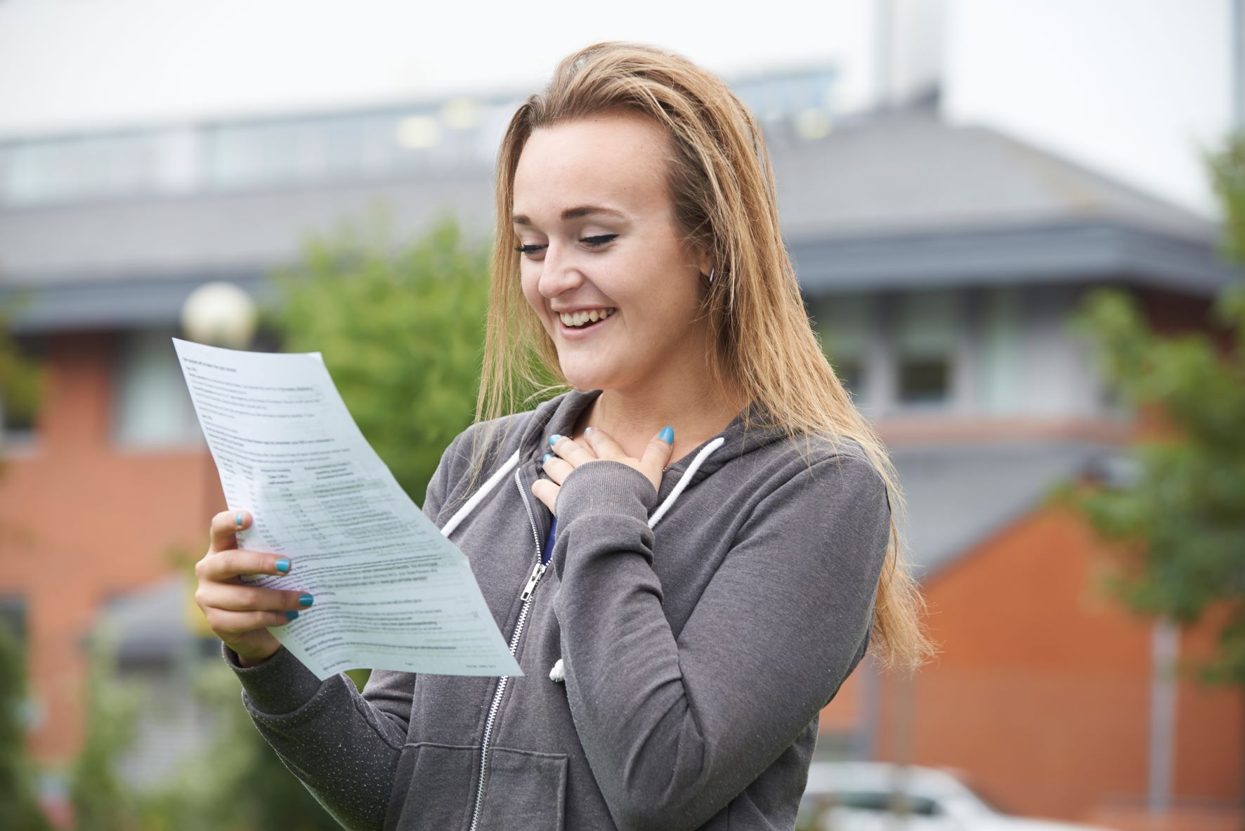 Woman smiling while reading her test results