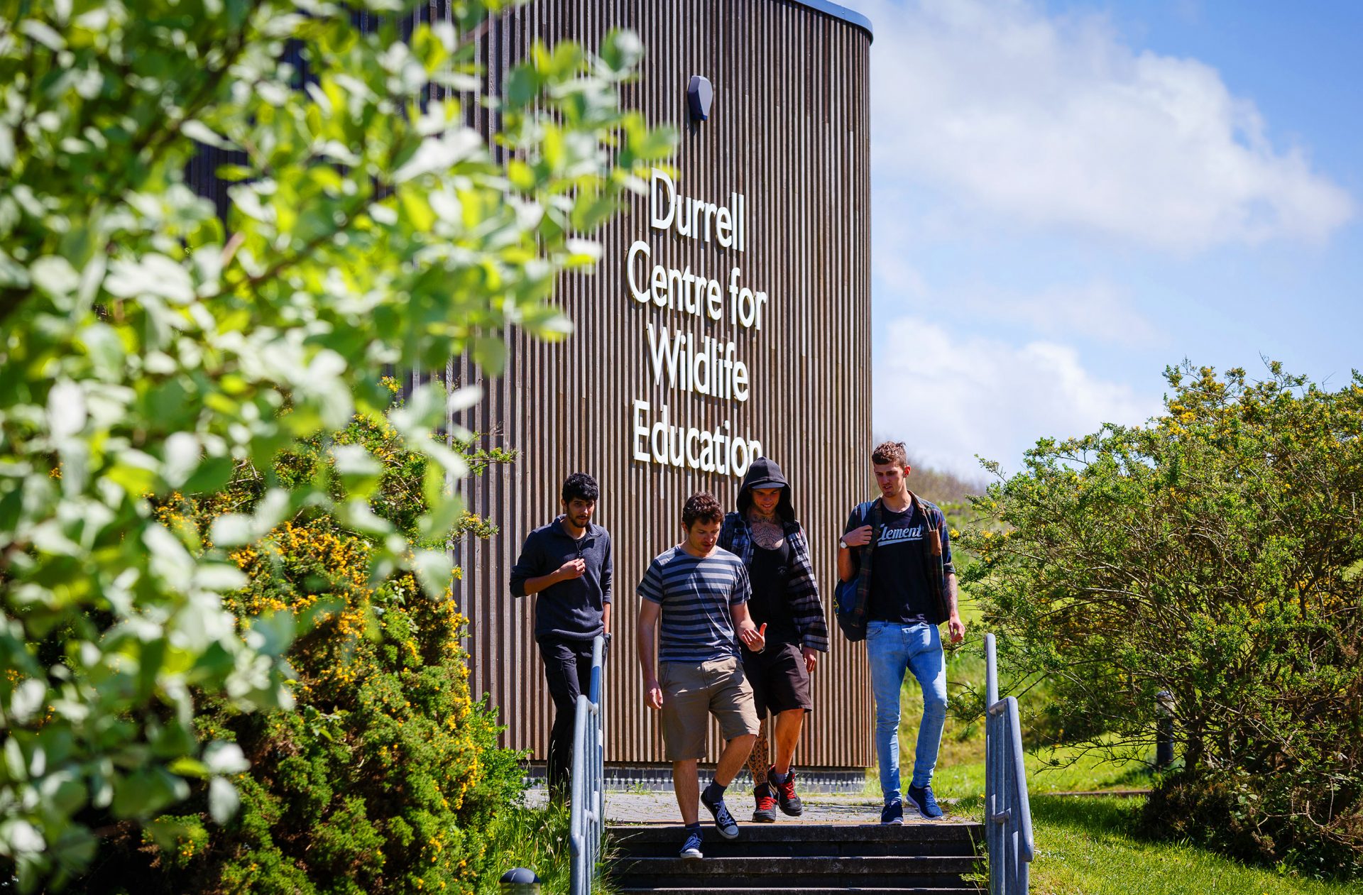 Students walking in front of building at Newquay campus