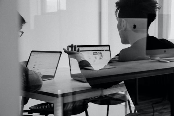 A digital trainer in front of a laptop