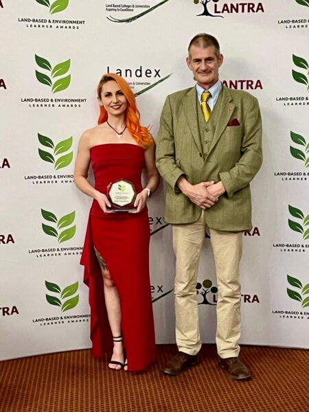 Student Kelsey accepting her award 